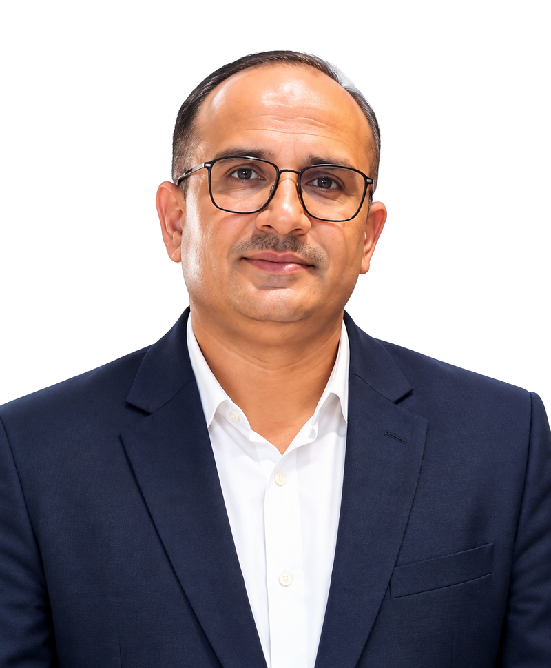 Naresh Choudhary, Founder and Chairman of Aditya Logistics, in a navy suit